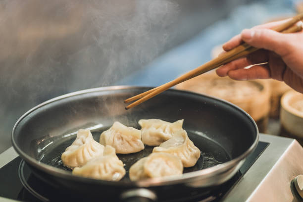 close-up of dumplings being fryed