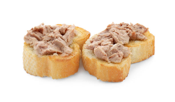 istock Tasty sandwiches with cod liver isolated on white 1822778565
