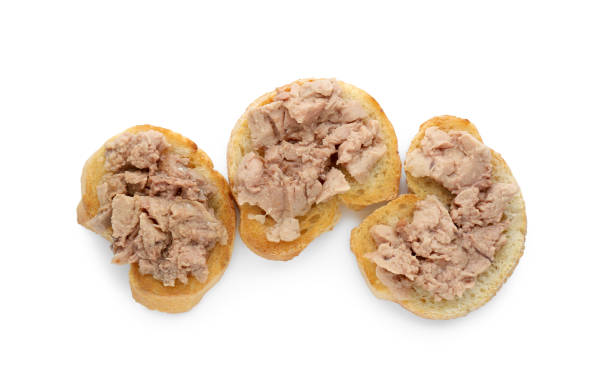 istock Tasty sandwiches with cod liver isolated on white, top view 1822778581