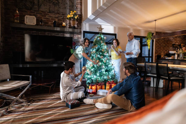 istock Family decorating the christmas tree at home 1822781403