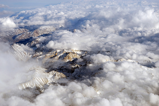 aerial view of snow mountains range from airplane