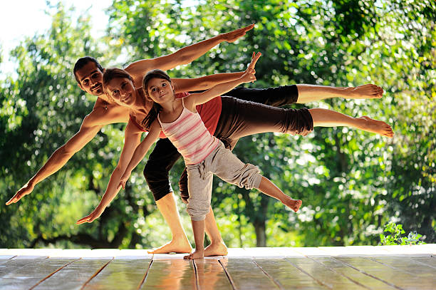 young family meditates