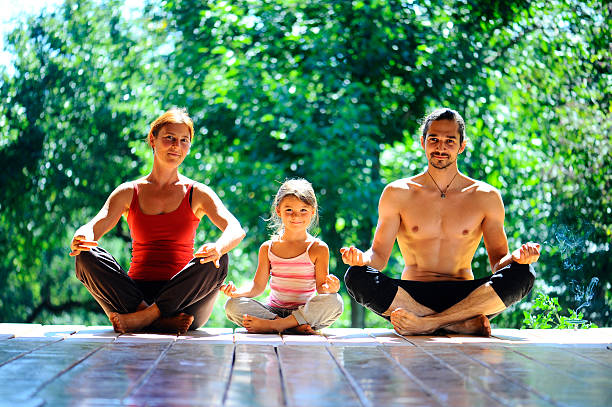 istock young family meditates 182279025