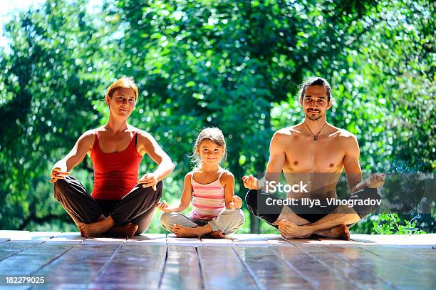 Young Family Meditates Stock Photo - Download Image Now - Activity, Adult, Balance