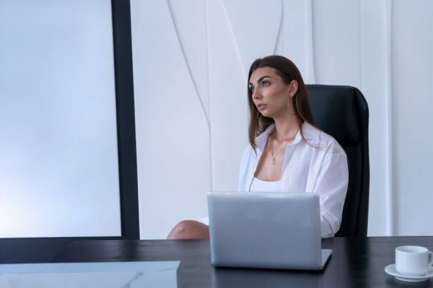 istock Brunette woman sitting at desk 1822793541