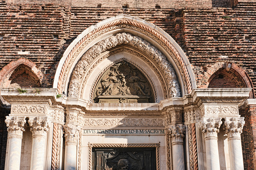Venice, Italy - November 9 2023: Facade Detail of Basilica dei Santi Giovanni e Paolo (San Zanipolo) - Huge Brick Italian Gothic Catholic Church in Castello