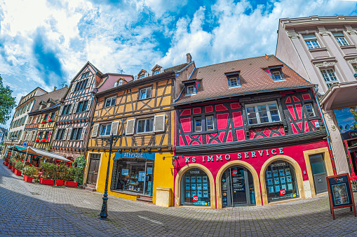Colmar, Alsace: Streets with traditional medieval Alsatian buildings, shops and companies. First mentioned by Charlemagne in 884. The city is renowned for its well-preserved old town.