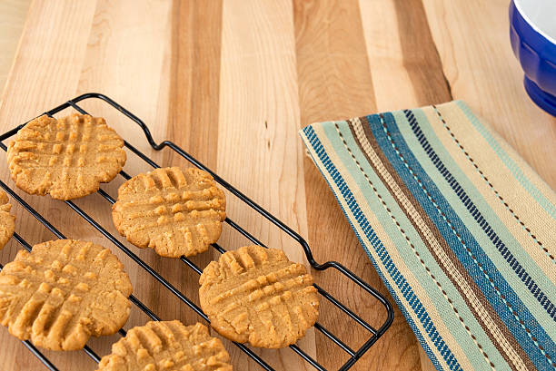 istock Peanut butter cookies cooling on rack 182279521