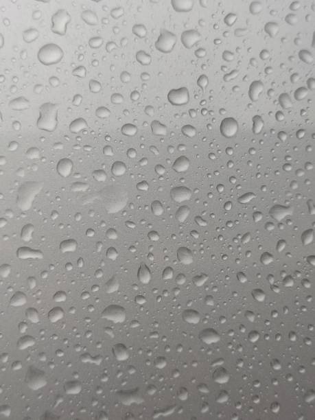istock rainwater on the car body 1822799242