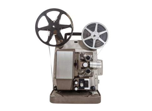 Old movie projector with film reels isolated.