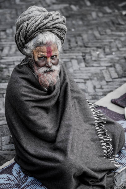 Kathmandu, Nepal- April 20,2019 : Sadhu-Indian Holy man sitting in the temple. In Hinduism, Sadhu is a common term for a mystic, an ascetic, practitioner of yoga.