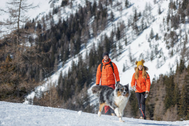 istock Couple enjoys a day outdoors on a snowy mountain 1822811790