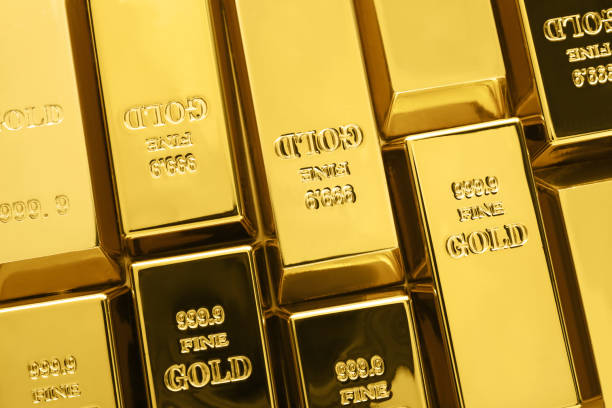 istock Many shiny gold bars as background, top view 1822823818