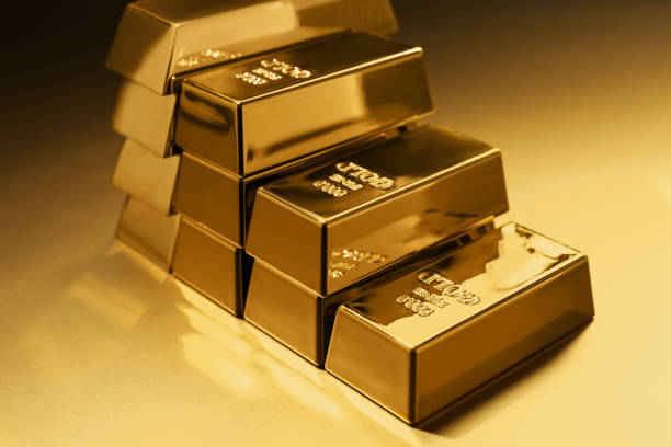 istock Stack of shiny gold bars on color background, closeup 1822824937