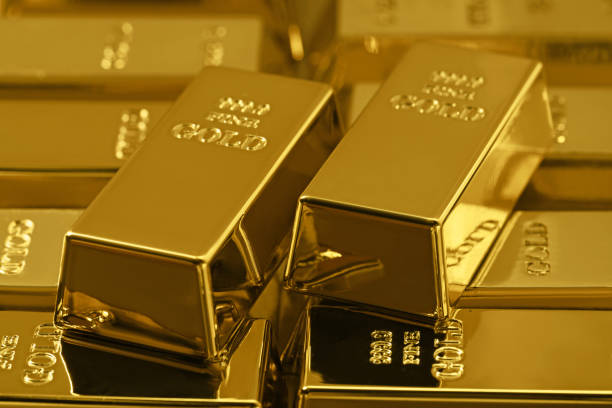 istock Many shiny gold bars as background, closeup 1822824939