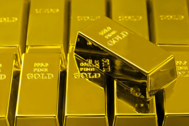 istock Many shiny gold bars as background, closeup 1822826193