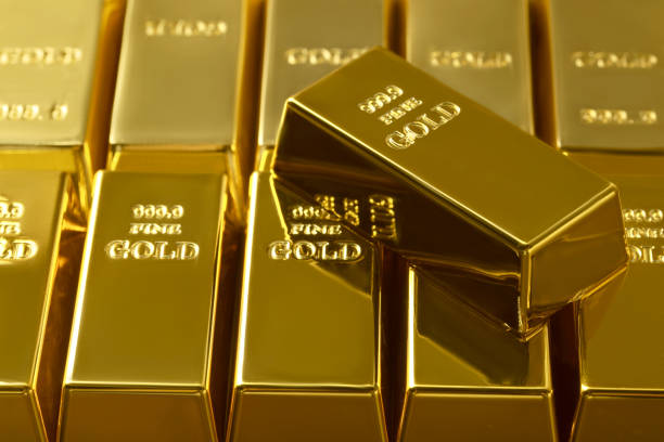 istock Many shiny gold bars as background, closeup 1822826815