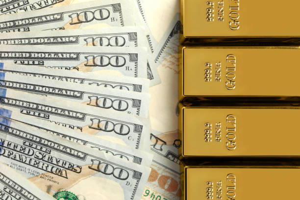 istock Shiny gold bars on dollar banknotes, flat lay. Space for text 1822826817