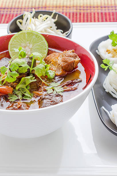 istock rice noodles with spicy pork sauce 182283306