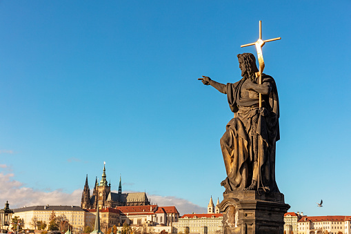 Statue of John the Baptist on Charles Bridge in Prague, Czech Republic