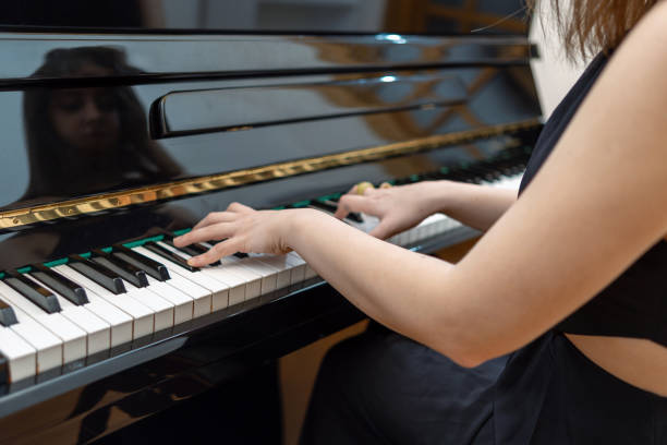 istock Close-up woman playing the piano 1822836182
