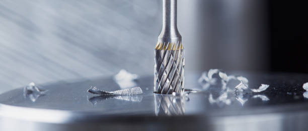 istock Milling cutter make sink in hole in steel billet. Locksmith work. 1822836237