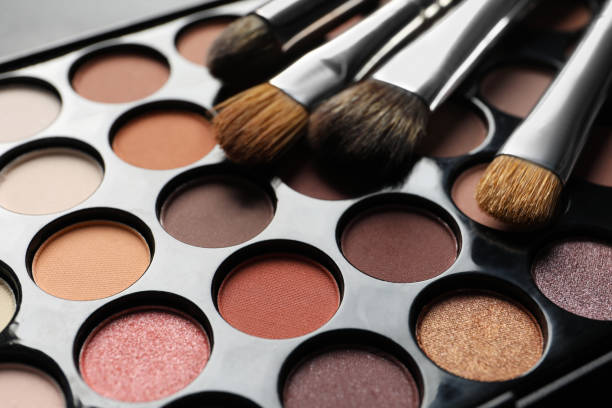 istock Beautiful eye shadow palette with brushes, closeup 1822836255