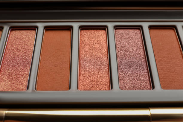 istock Beautiful eye shadow palette with brush as background, closeup 1822836442