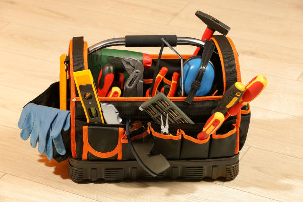 istock Bag with different tools for repair on white wooden table 1822837256