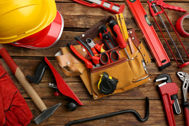 istock Leather belt and different tools for repair on wooden table, flat lay 1822837651