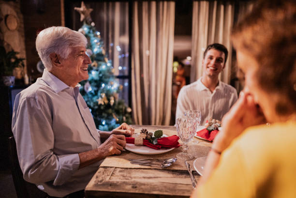 istock Senior man talking with his family at Christmas dinner 1822837796