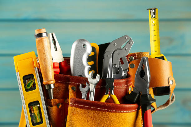 istock Belt with different tools on light blue wooden background, closeup 1822837830