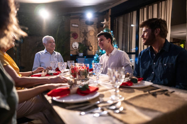 istock Senior man talking with his family at Christmas dinner 1822845479
