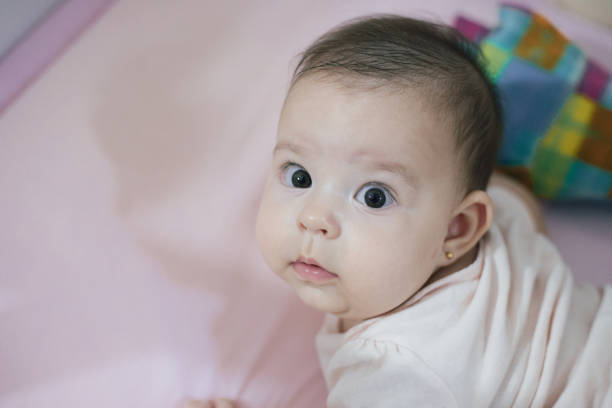 istock baby laughing and happy looking 1822846839