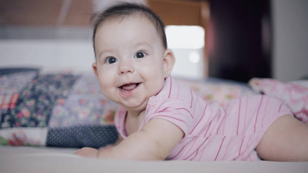 istock baby laughing and happy looking 1822846845
