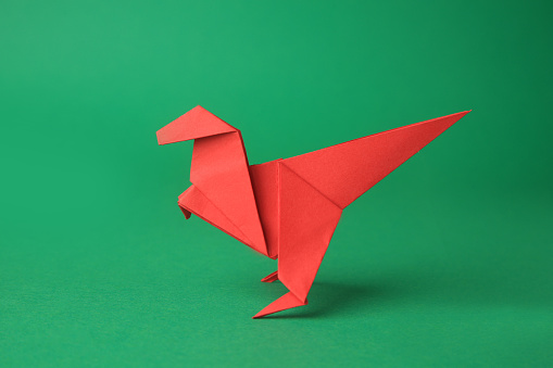 Origami butterflies on a red background