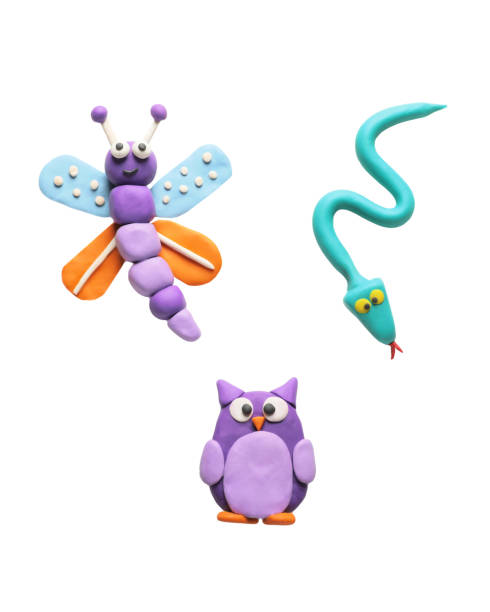 istock Colorful plasticine, butterfly, snake and owl on white background, top view 1822850452