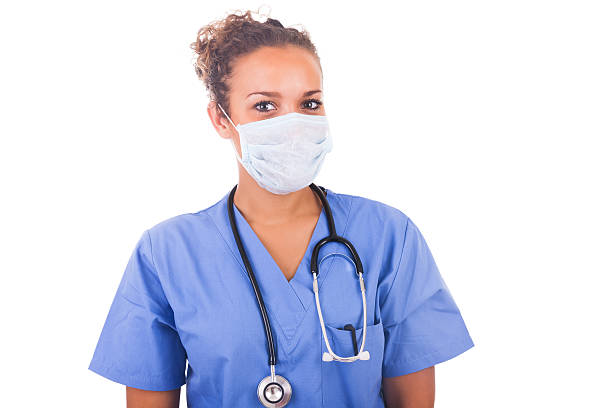 istock Young doctor with mask and stethoscope isolated on white backgro 182285499