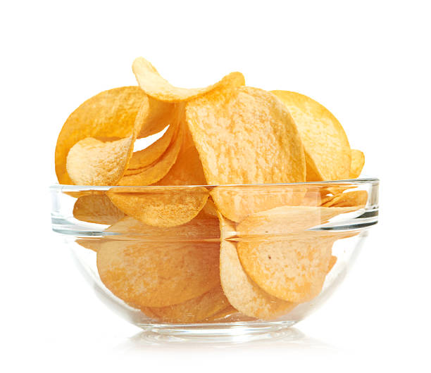 istock Delicious potato chips in bowl isolated on white 182285646