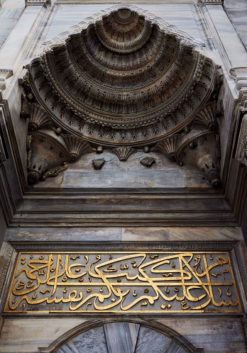 An ornately decorated entrance to a building in Istanbul, featuring gold accents and intricate designs