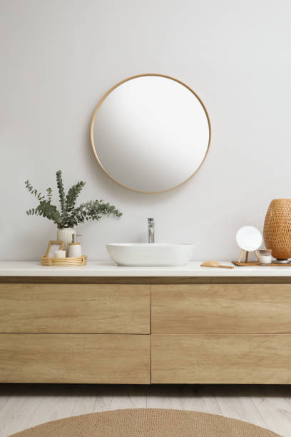 istock Modern bathroom interior with stylish mirror, eucalyptus branches and vessel sink 1822870140