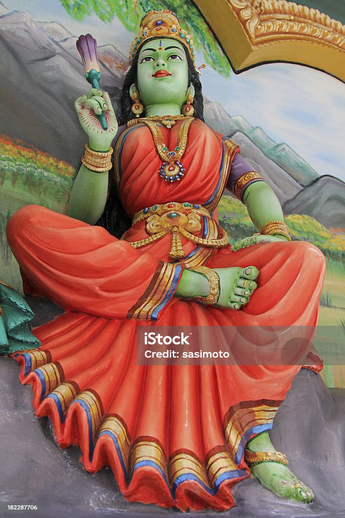Statue de Lakshmi avec une fleur de lotus à la main - Photo de Déesse libre de droits