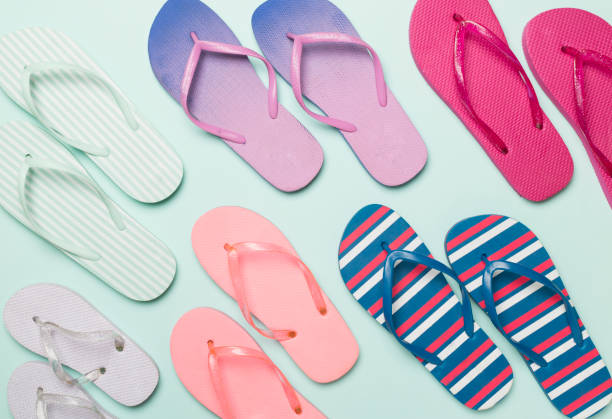 istock Bright flip flops on color background, top view 1822898869