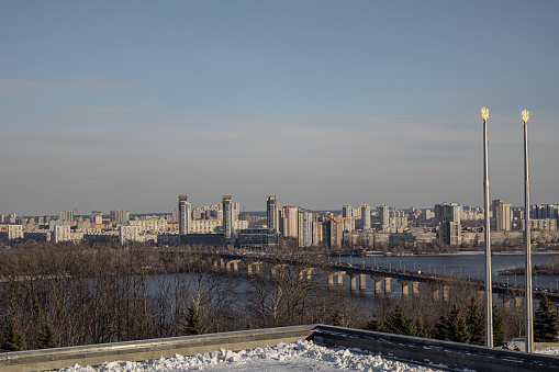 Kyiv, Ukraine. 30.11.2023: view of the left bank of Kyiv and the bridge over the Dnipro River.