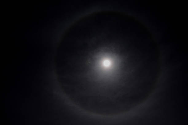 istock Full moon in a cloudy sky with halo 1822904838