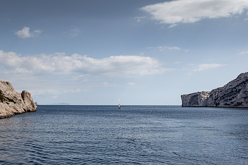 Sailboat and cliffs in the Calanques of Marseille