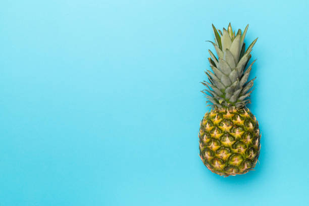 istock Fresh pineapple on color background, top view 1822913222