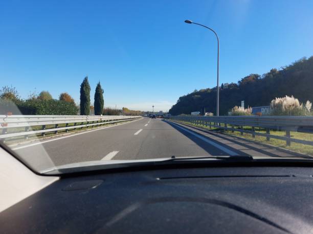 istock free highway with car dashboard in the foreground during a trip 1822913766