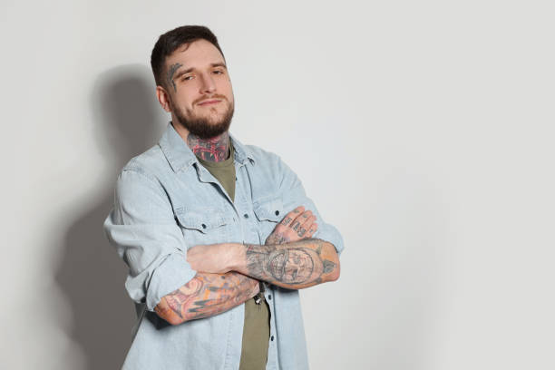 Portrait of hipster man on light grey background. Space for text