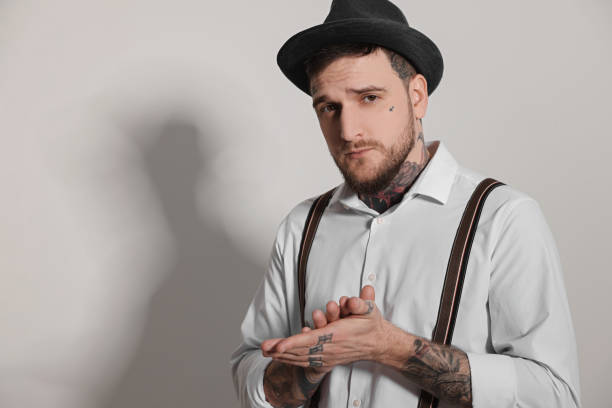 istock Portrait of handsome hipster man on light grey background. Space for text 1822917100